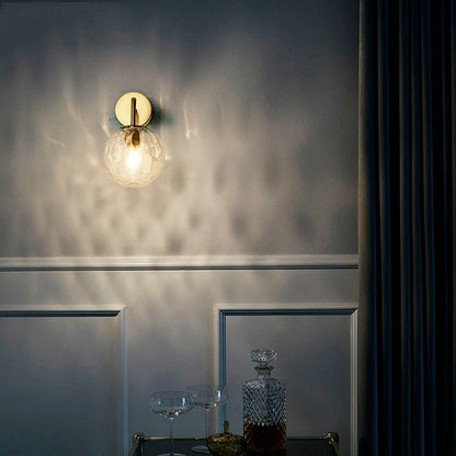 Contemporary Textured Globe Wall Light with Brass Arm | Single-Bulb Sconce for Bedroom, Hallway & Living Room | Hardwired Electric Fixture