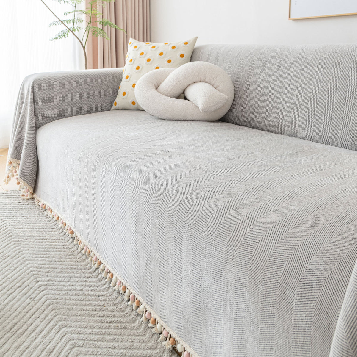 Housse de canapé Liora – Housse durable à motif chevrons, finition à franges