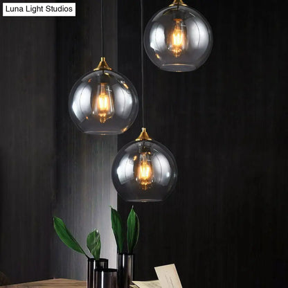 Three-Light Hanging Ceiling Fixture with Tapered Glass Globes in Antique Brass Finish for Dining Room Kitchen Island