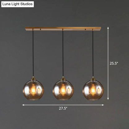 Three-Light Hanging Ceiling Fixture with Tapered Glass Globes in Antique Brass Finish for Dining Room Kitchen Island