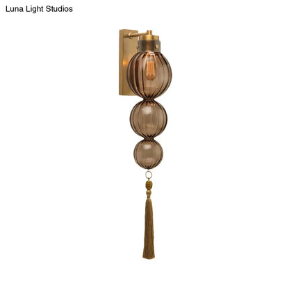 Round Glass Wall Sconce with Decorative Tassel | Asian-Inspired Globe Fixture | Chrome or Brass Finish for Living Room, Hallway, Bedroom