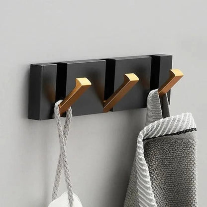 Patère murale élégante et peu encombrante au design pliable